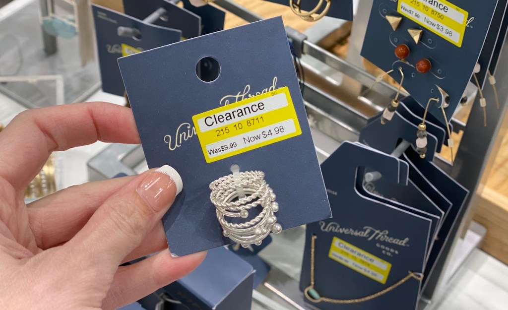 hand holding rings with a clearance tag