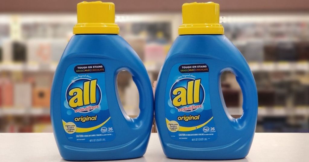two bottles of laundry detergent on a shelf at store