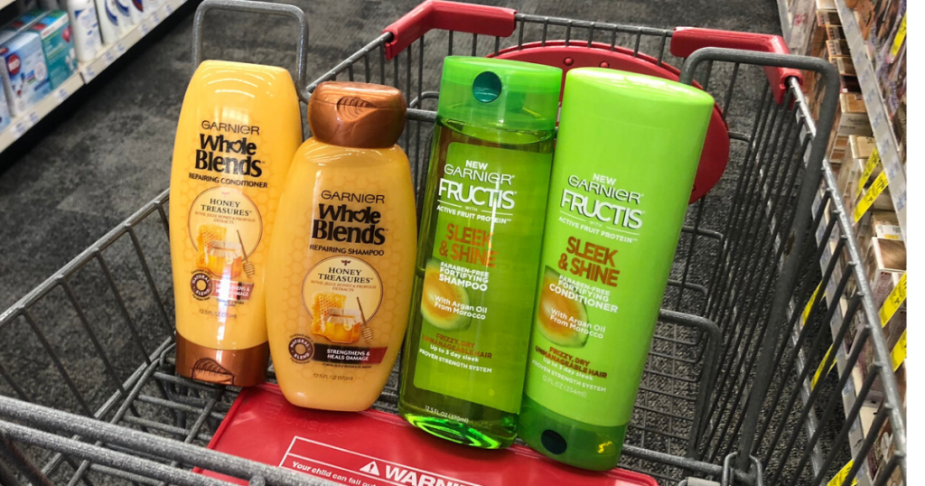 fourn bottles of shampoo and conditioner in front basket of shopping cart