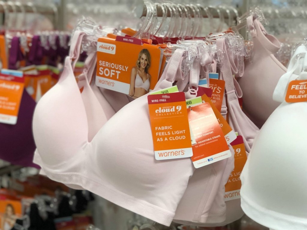 Women's bra in pink hanging on hanger in store on display
