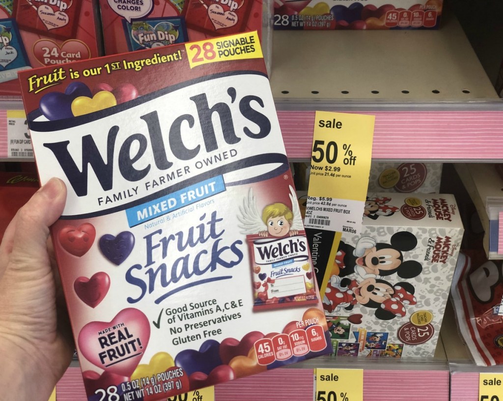 woman holding Welch's Fruit Snacks 28-Count Box