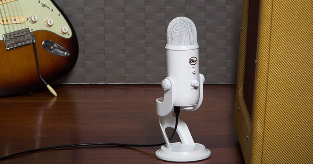 Whiteout Blue Yeti Microphone with guitar in background