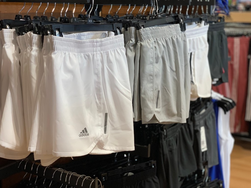 rack with shorts on hangers at a store