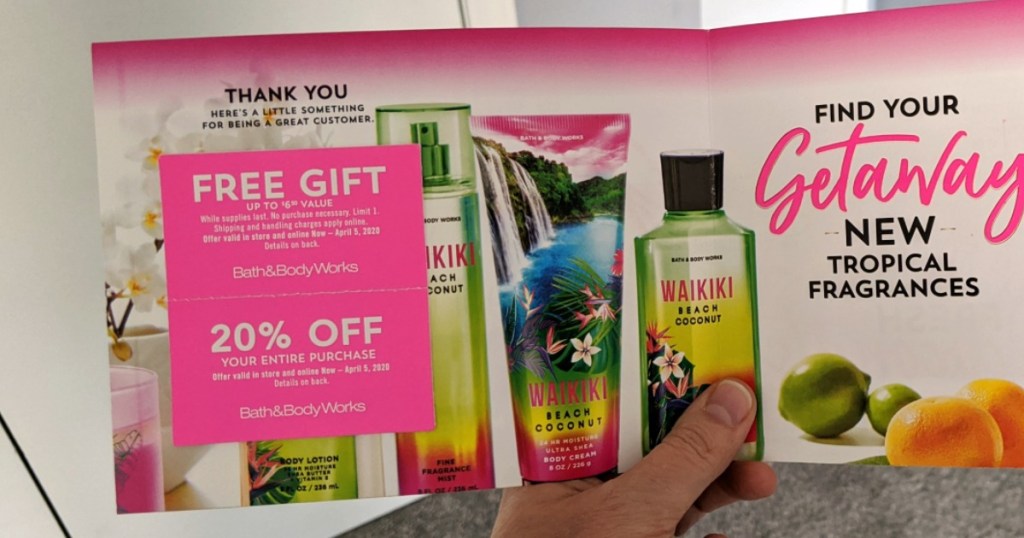 hand holding bath and body works coupons
