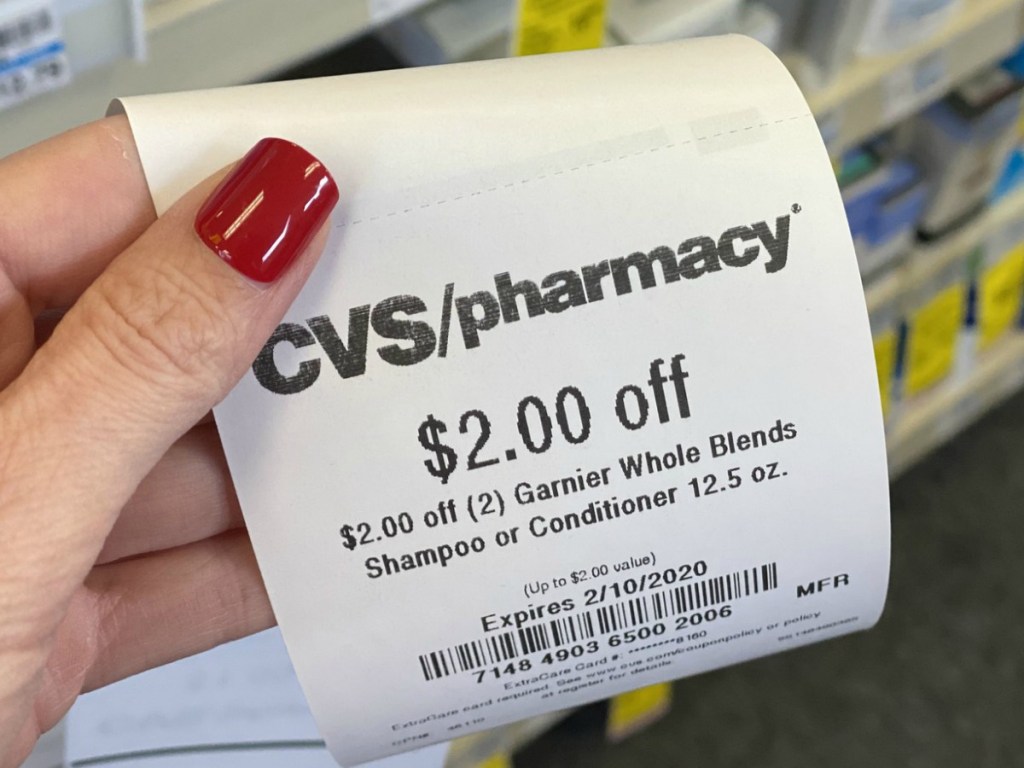 hand holding receipt from CVS at store