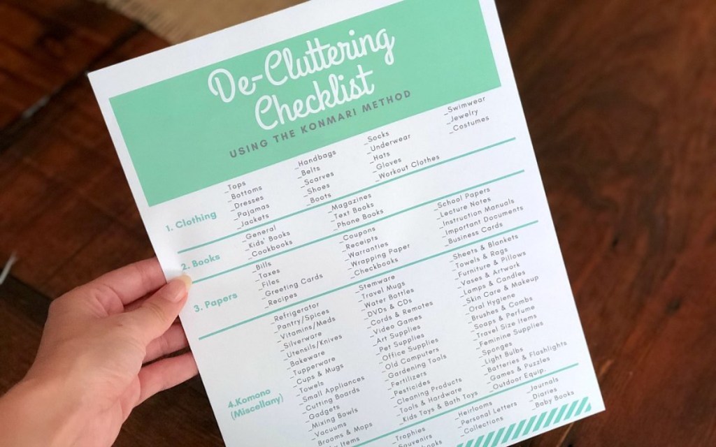 hand holding a decluttering checklist
