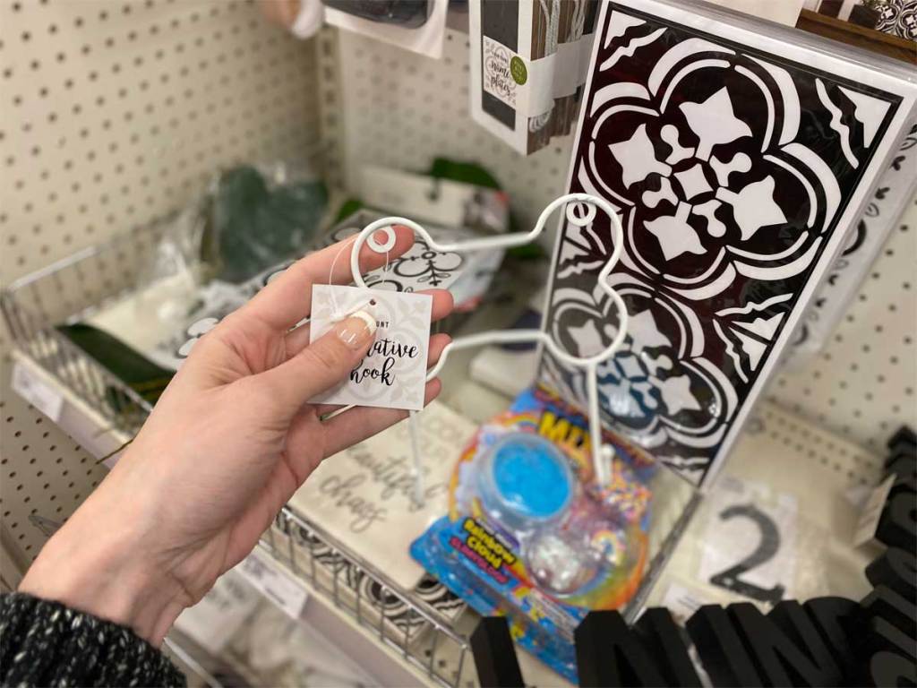 hand holding dogbone decorative hooks