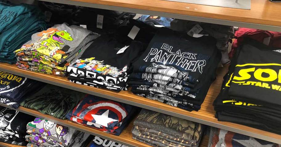 A shelf full of tshirts.