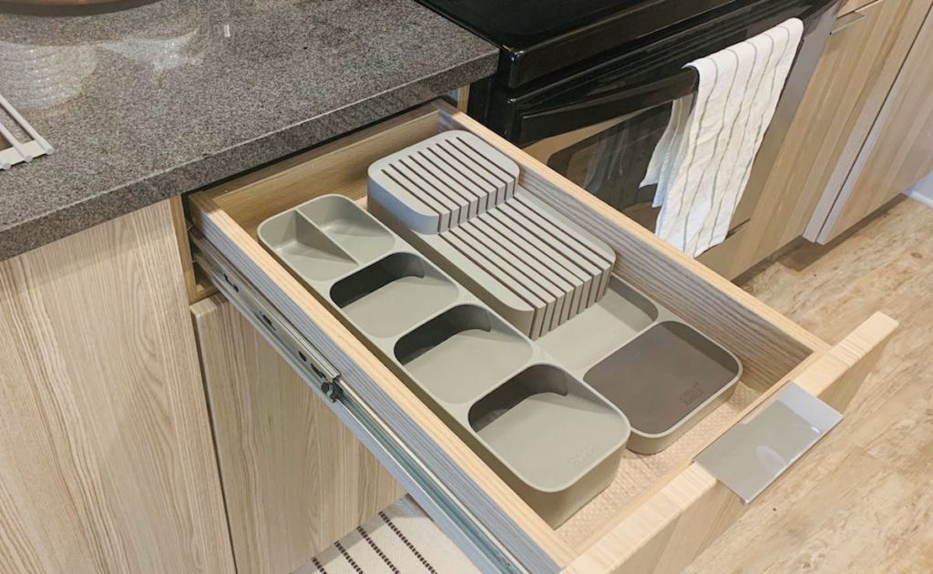 open kitchen drawer with gray joseph joseph cutlery and knife organizers