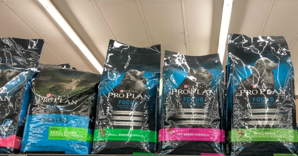 bags of Purina dog food on a store shelf