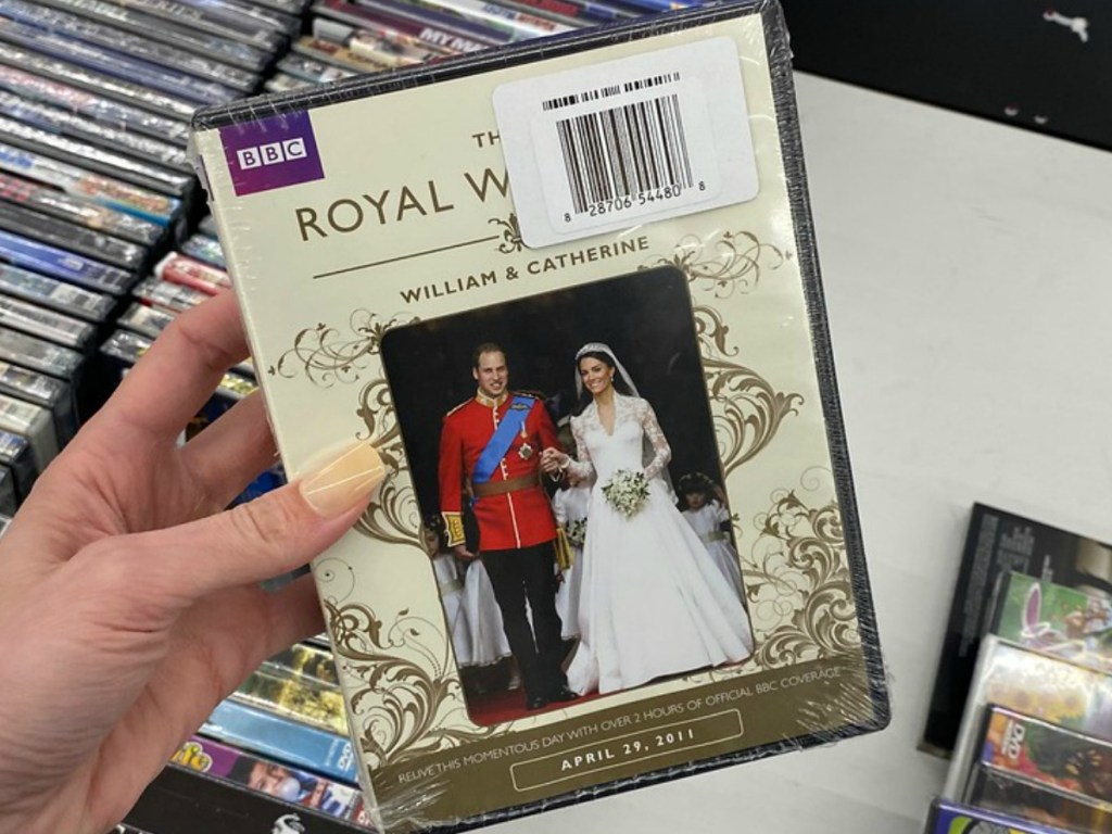 hand holding DVD with wedding couple pictured on it