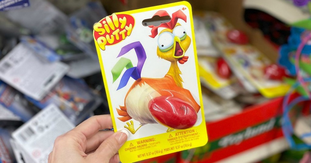 hand holding package with chicken on it that says "silly putty"