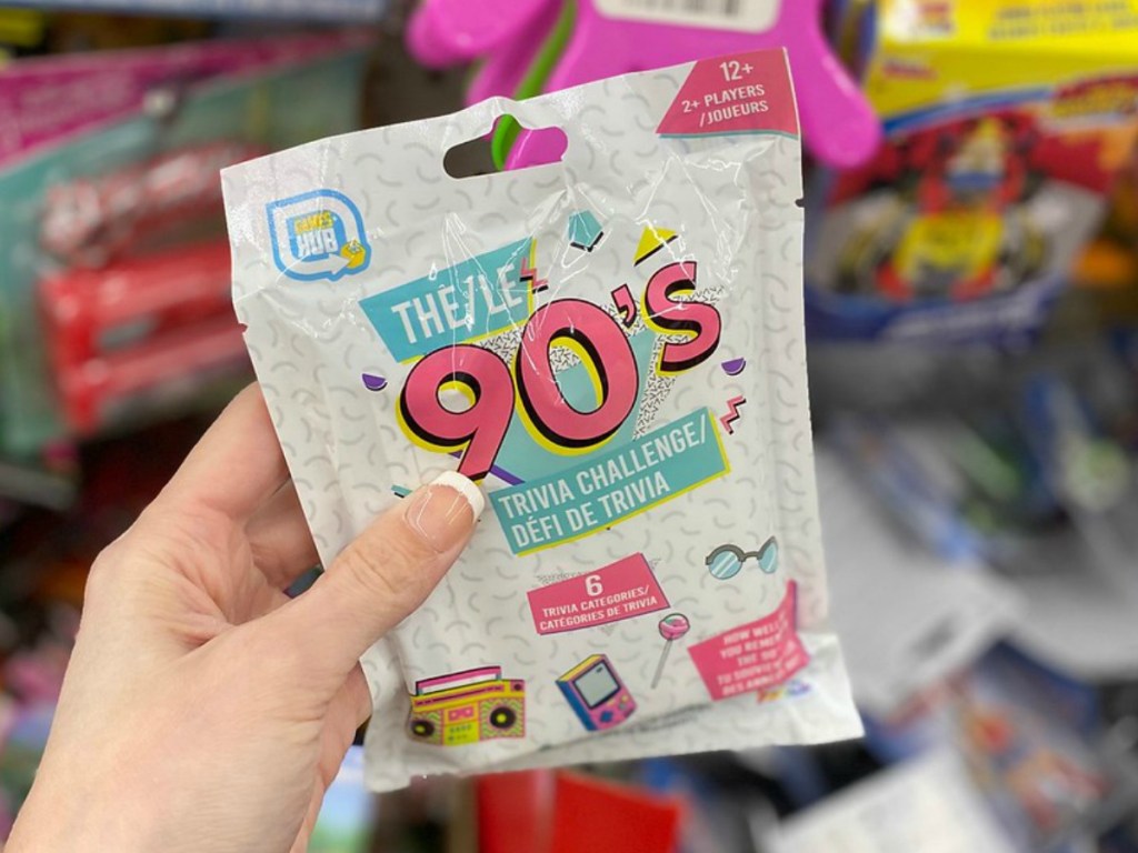 hand holding plastic package with vintage game in it