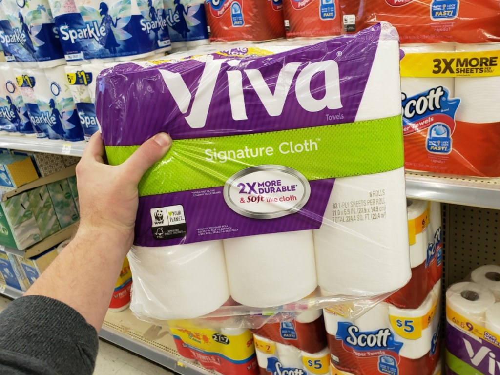 hand holding paper towels 