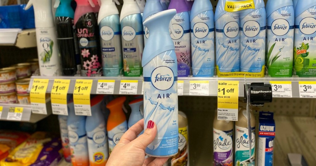 hand holding air freshener in a store