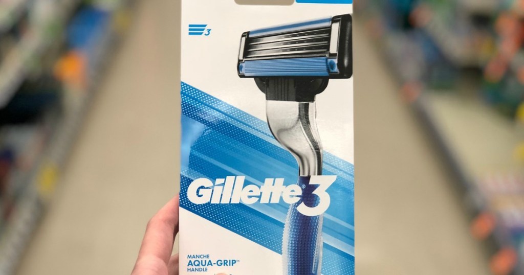 hand holding a men's razor in a store