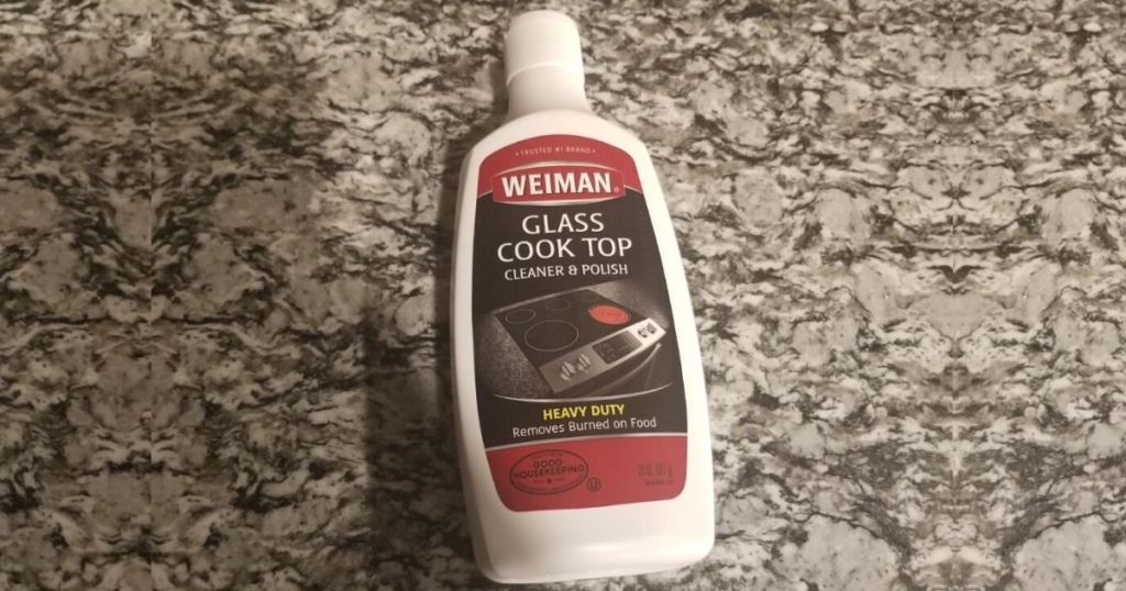 bottle of glass cooktop cleaner on granite countertop