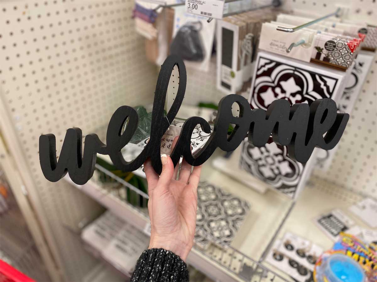 hand holding Large Home Wood Word Decor "Welcome"