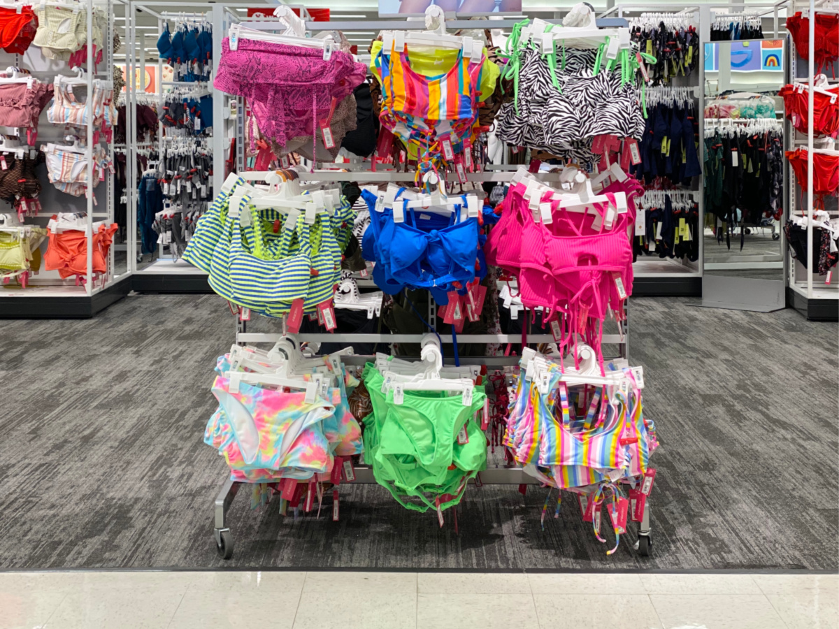 swim tops and bottoms on store rack in store