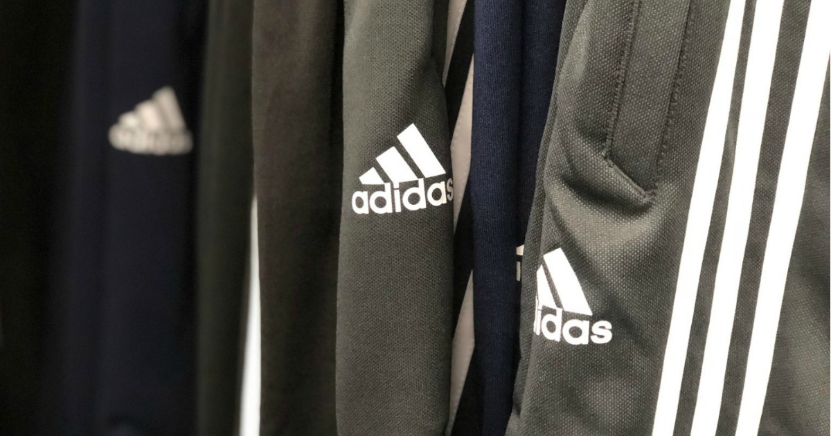 Adidas pants on hangers in store on display