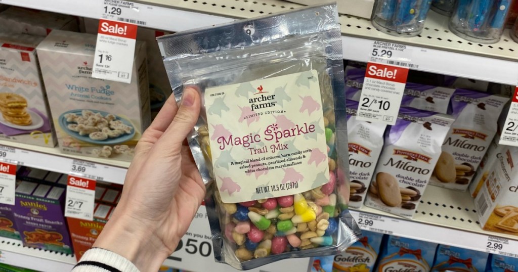 woman holding up a bag of Archer Farms Magic Sparkle Trail Mix