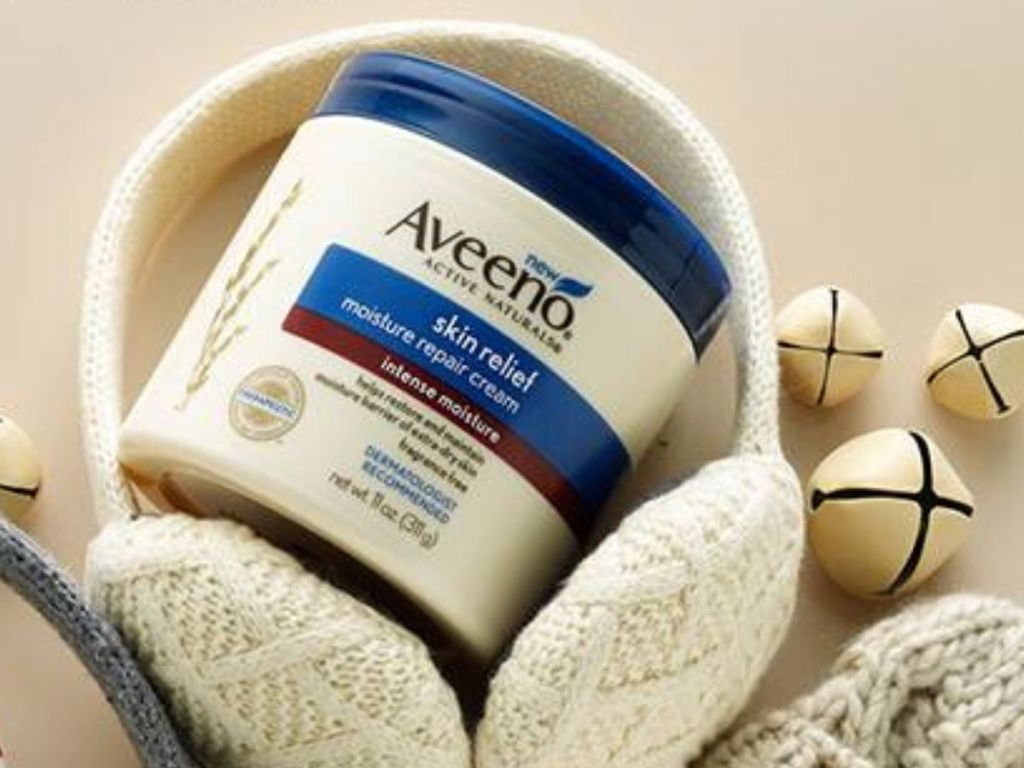 small tub of moisturizer within knit sweater-like earmuffs and bells