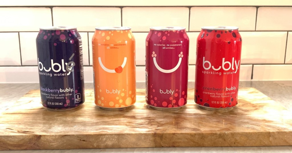 four flavored sparkling water colored cans on kitchen counter