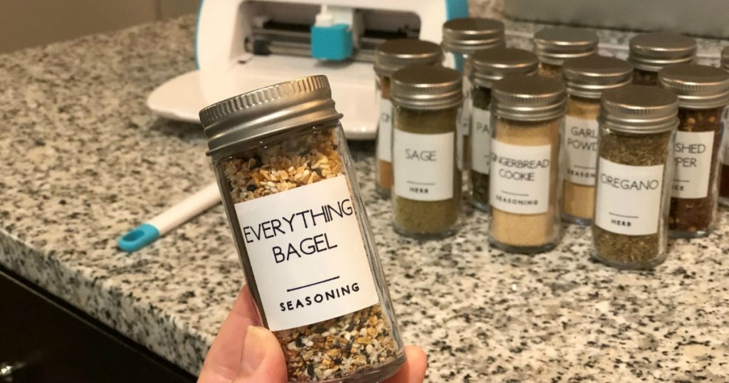 holding everything bagel seasoning spice in front of cricut machine 