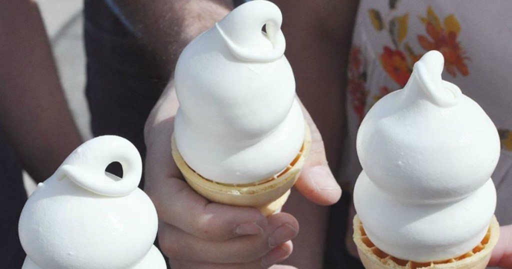 people holding ice cream cones