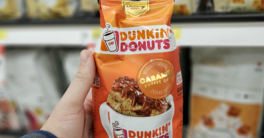 hand holding package of Dunkin donuts coffee