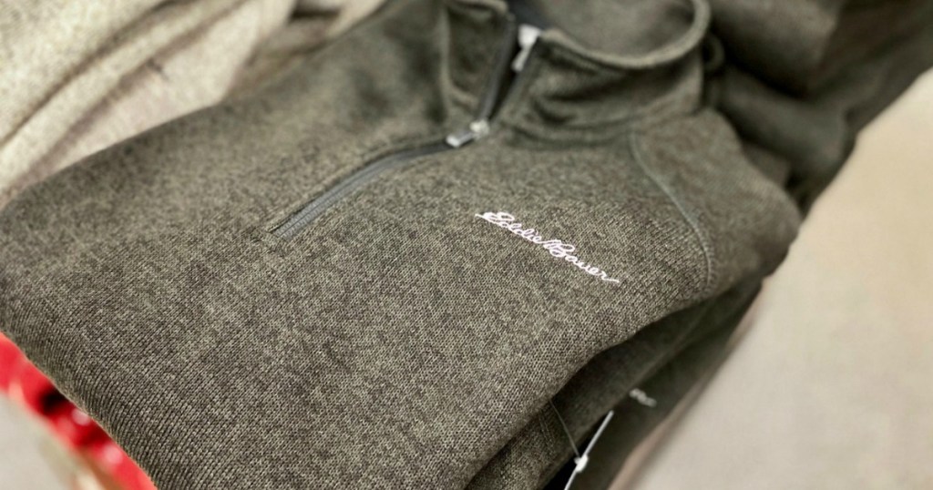 Men's gray pullover on display in-store