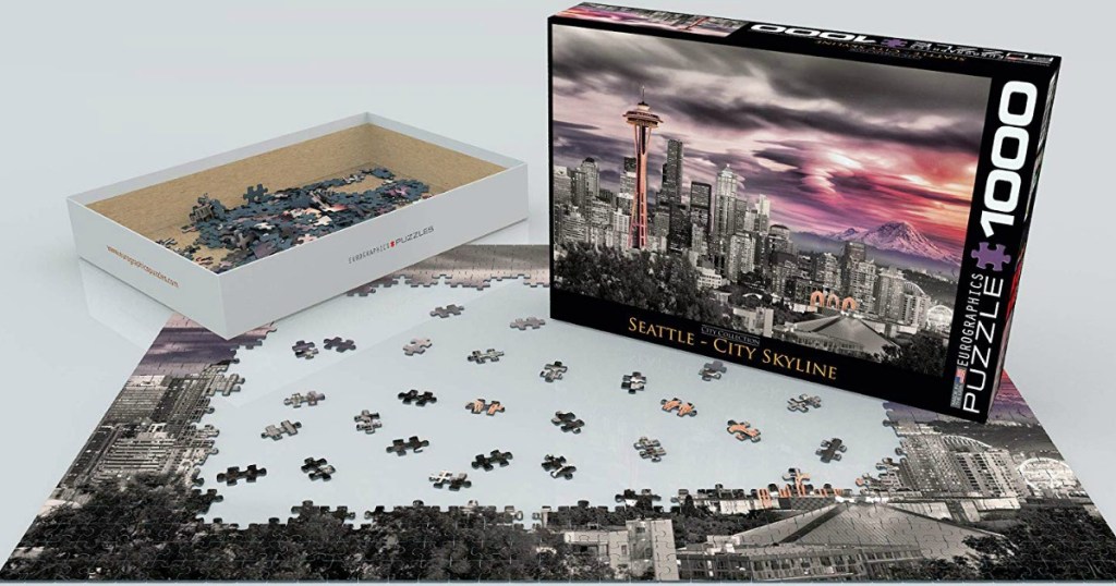 Large scenic puzzle partially put together near storage box
