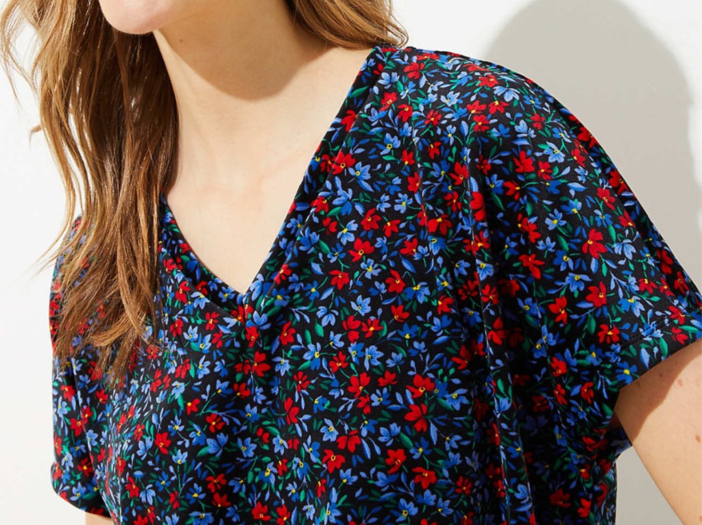 woman in red and blue floral velvet top