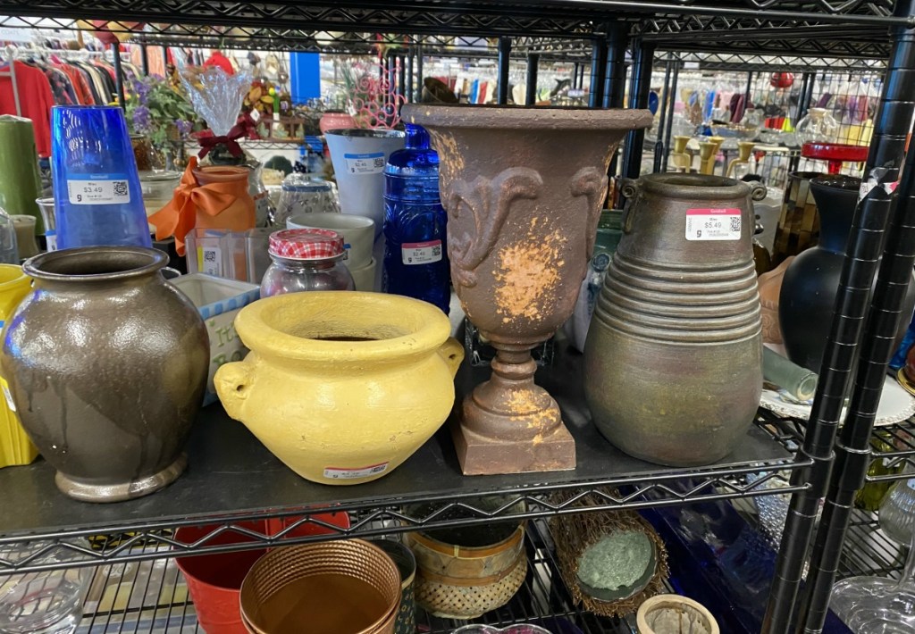 Goodwill shelves with pottery pieces