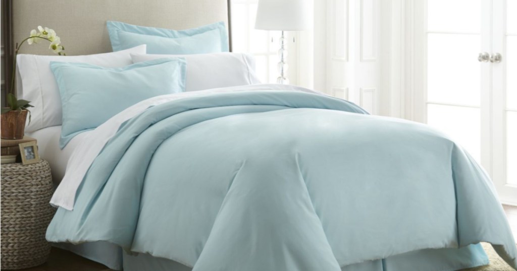 blue comforter set on bed