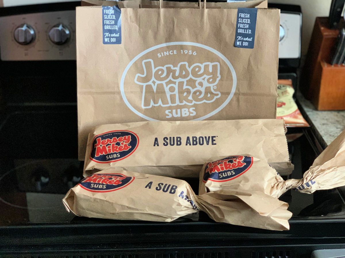 jersey mikes to go bag with giant, regular, and mini sub in front of it