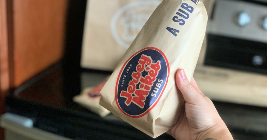 hand holding wrapped up jersey mikes sub