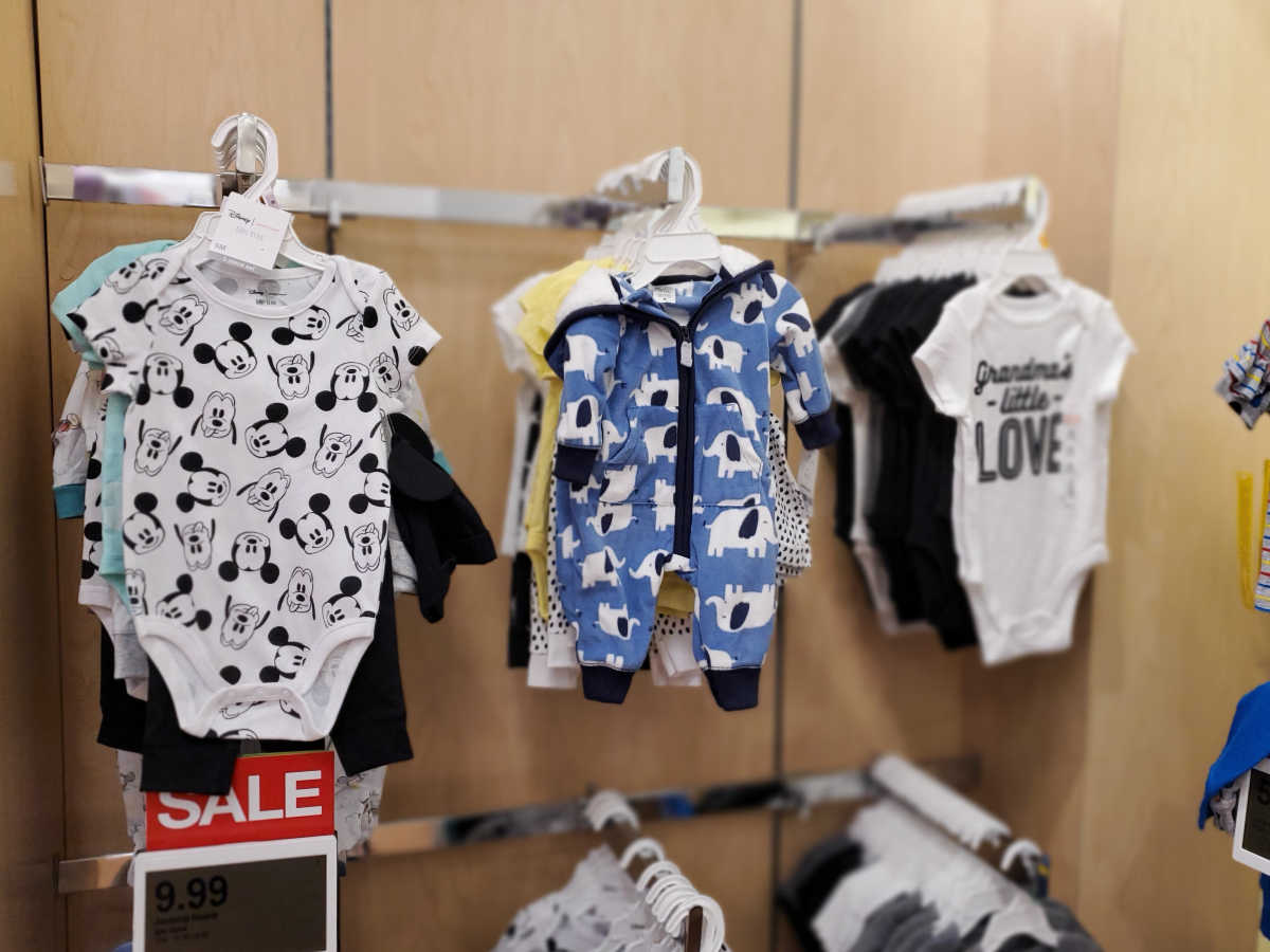 jumping bean onesies with disney hanging up