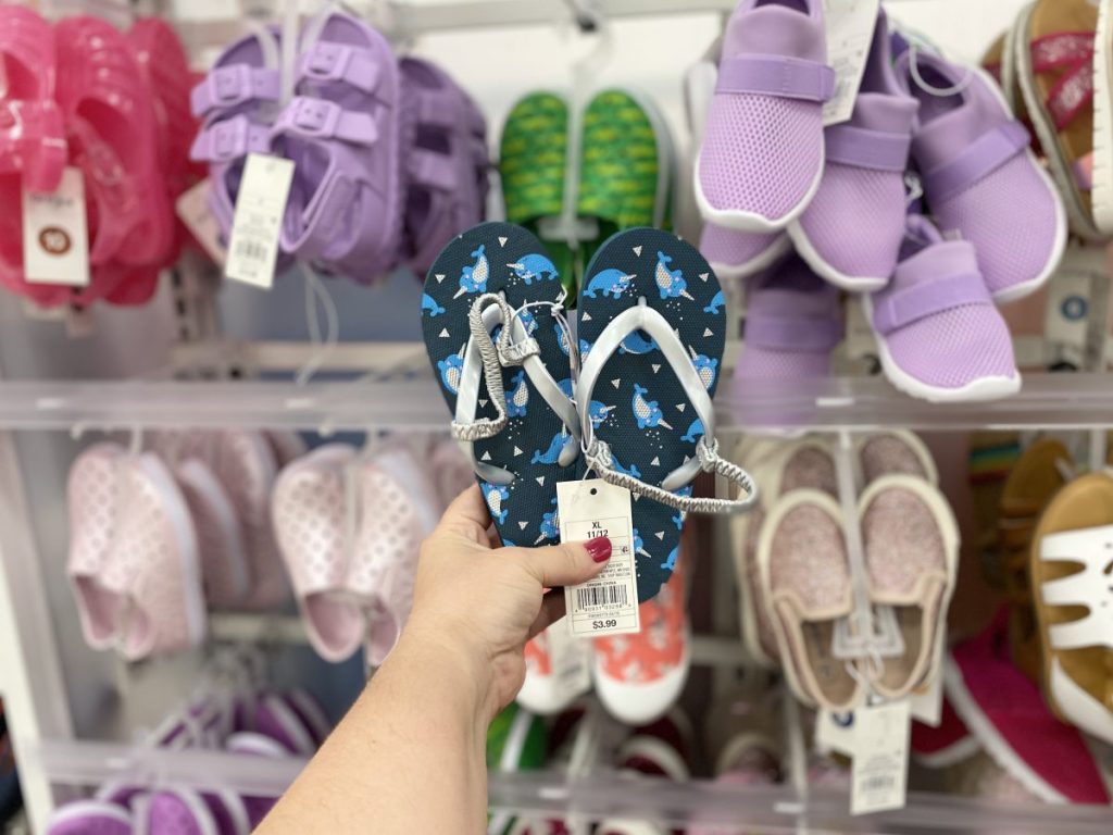 Hand holding up Kids Sandals
