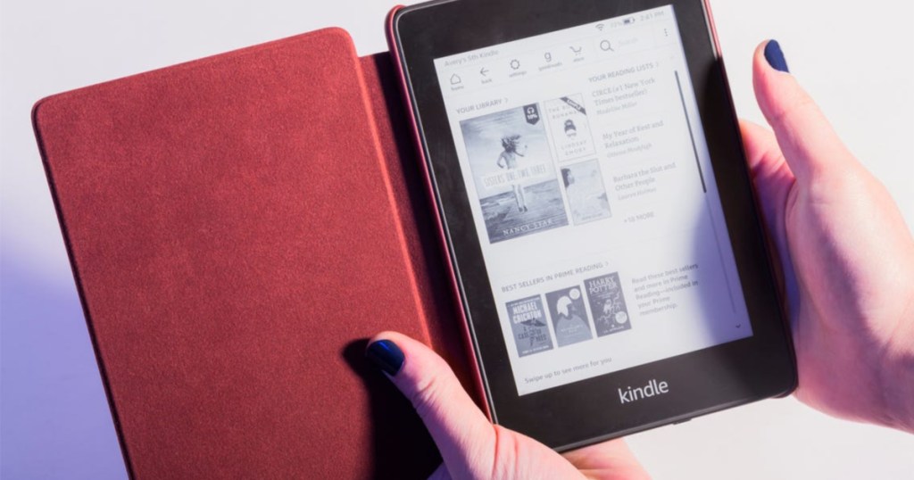 woman holding eBook reader in red case
