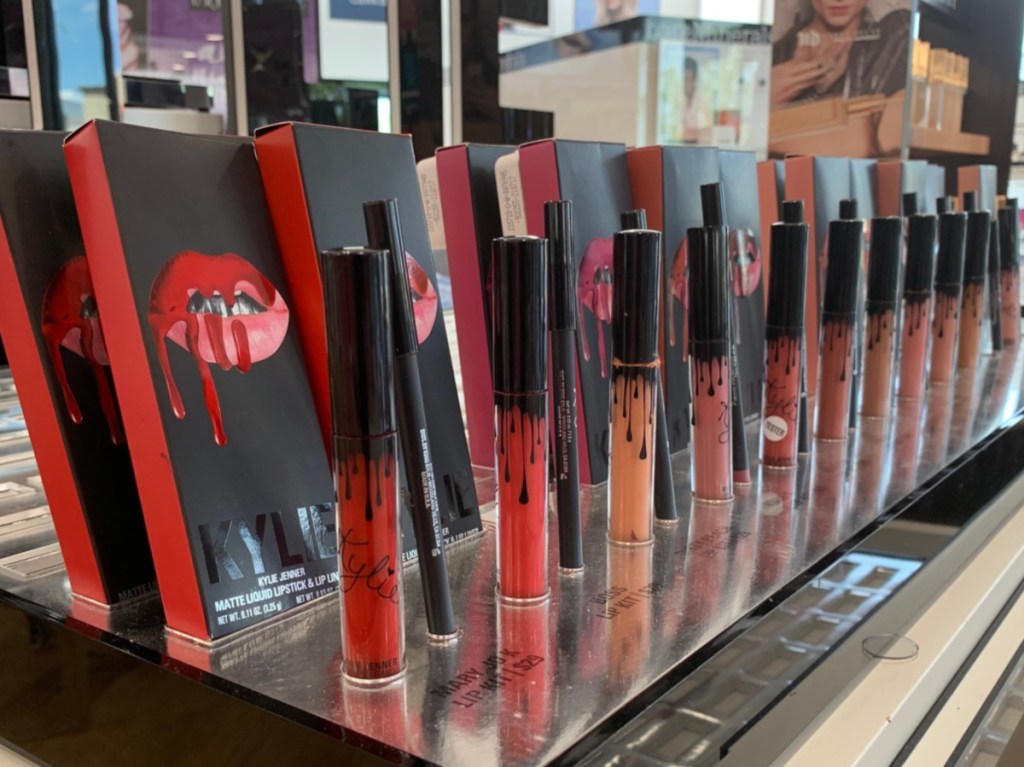 lipsticks standing in store display in makeup store