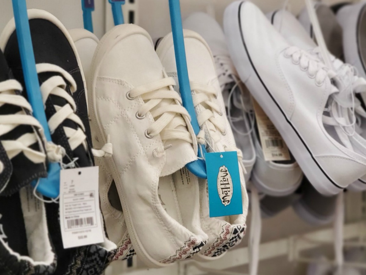 Women's slip-on sneakers on hanger in-store on display