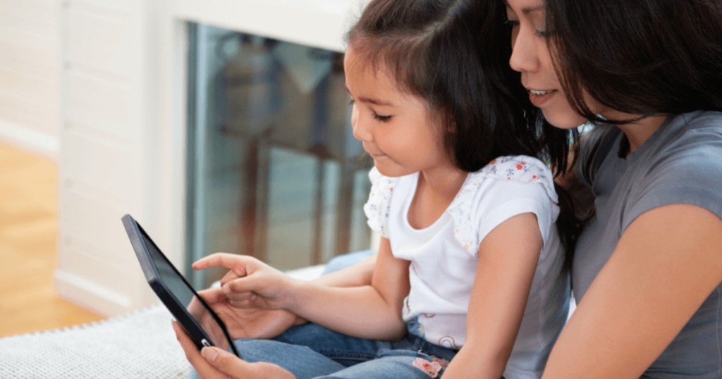 mother and daughter using tablet