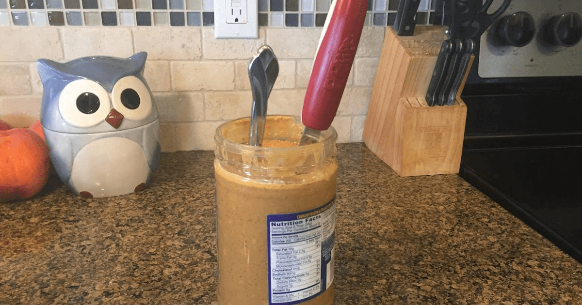 comparison of regular knife with large red peanut butter knife in a jar