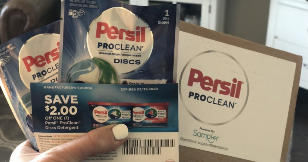 Woman holding Persil ProClean Samples and coupon