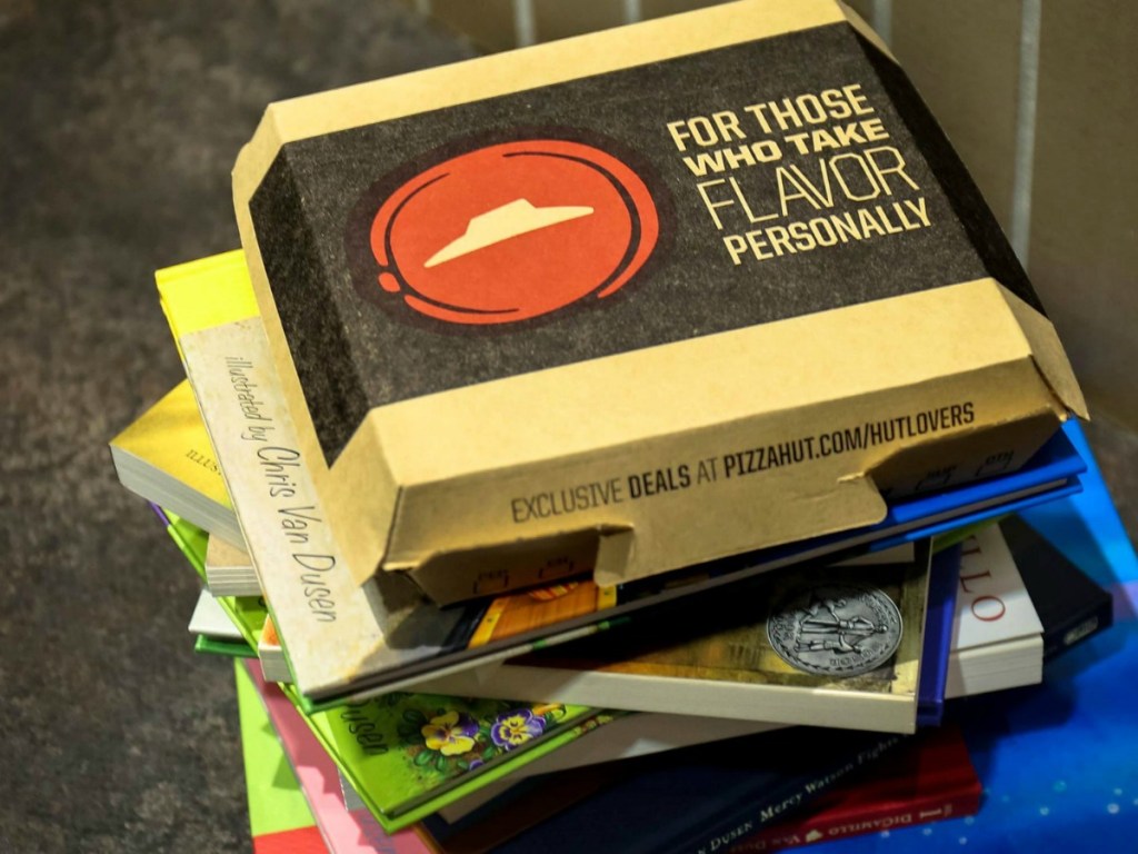 Pizza Hut Pizza Box on top of books