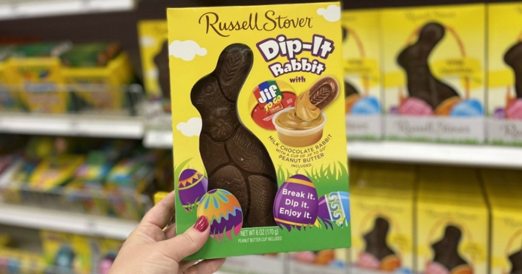 woman holding Russell Stover's New Dip-It Rabbit