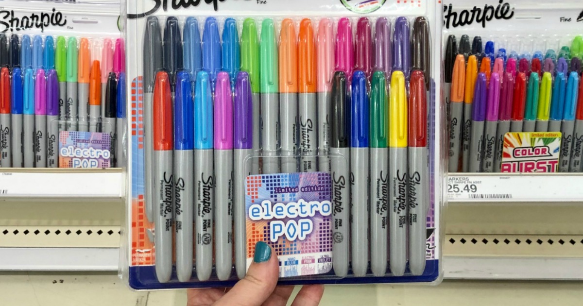 Large package of sharpie markers in hand near in-store display