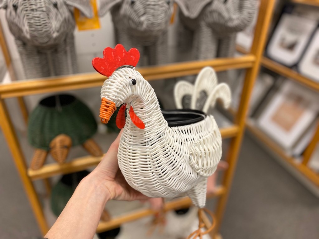 hand holding a planter that looks like a chicken