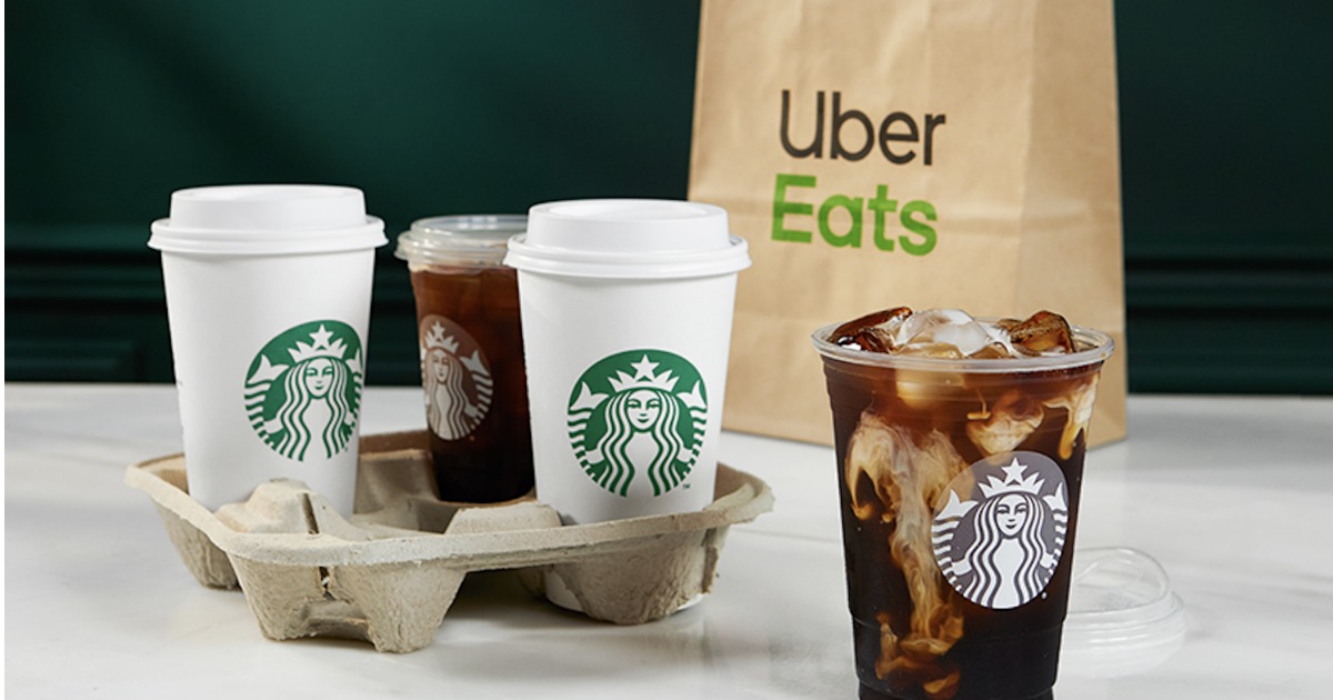 Starbucks drinks next to Uber Eats bag